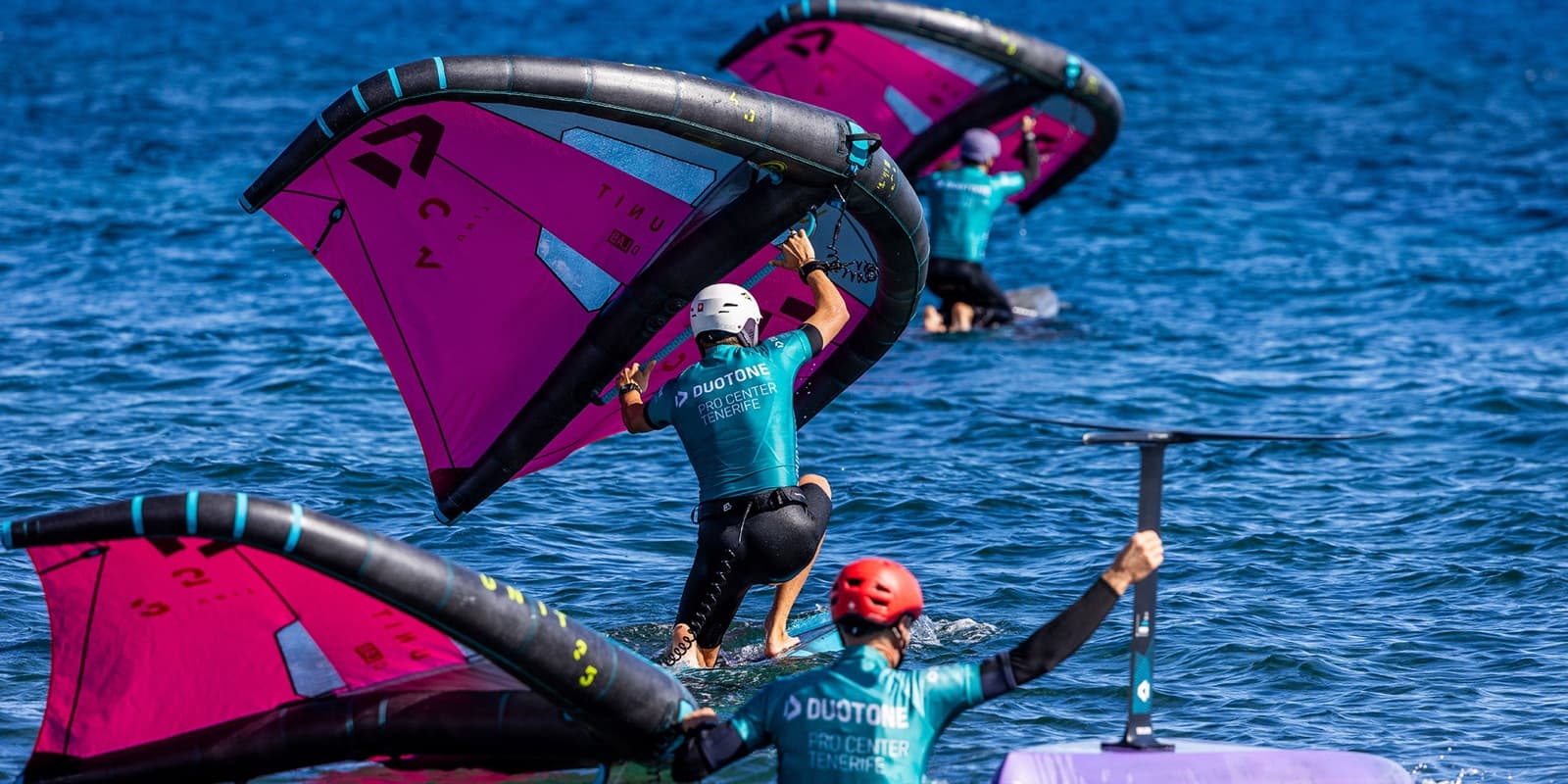 Riders launching their pink Duotone wings at Duotone Pro Center Tenerife