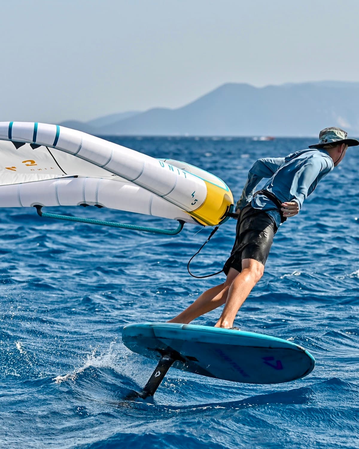 Wing foiling across Vassiliki Bay