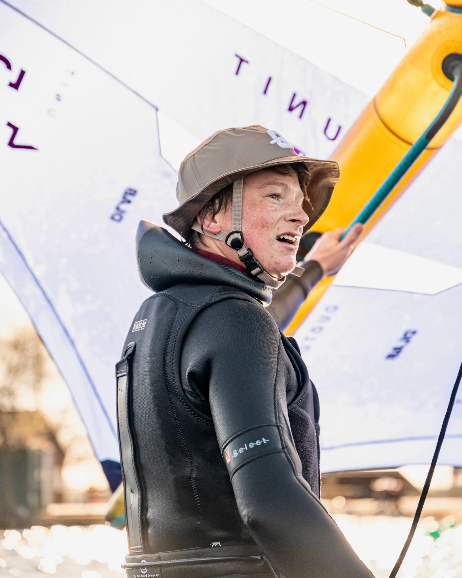 Toby Cunliffe holding his wing at the water's edge