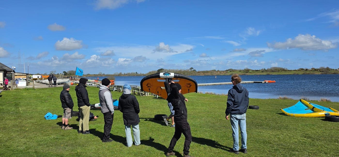 Clinic group watching a wing demo by Stithians Lake